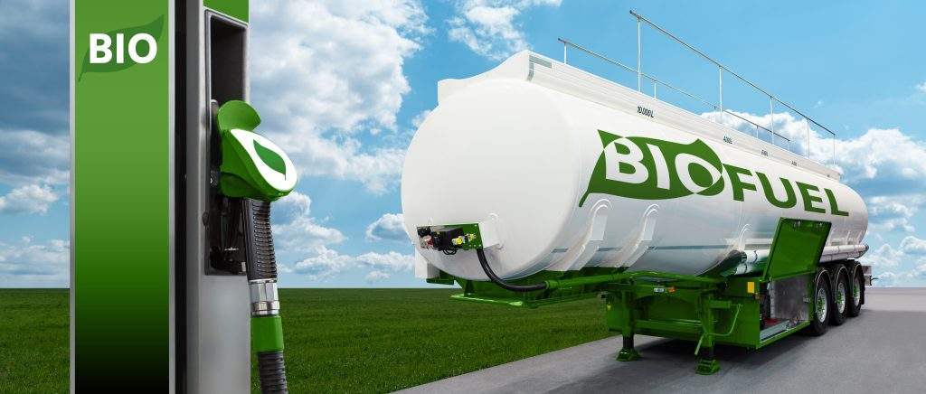A biofuel tanker trailer next to a biofuel pump.